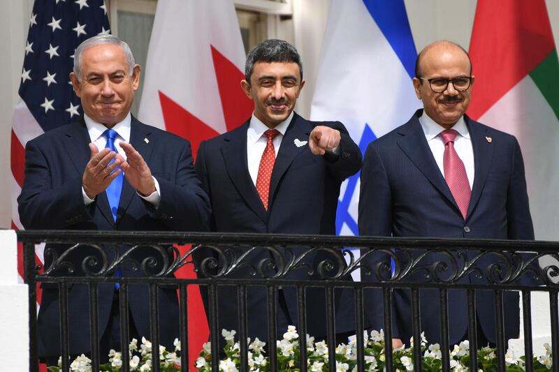 Sheikh Abdullah, with Mr Netanyahu, left, and Mr Al Zayani at the signing of the Abraham Accord on the South Lawn of the White House. AFP