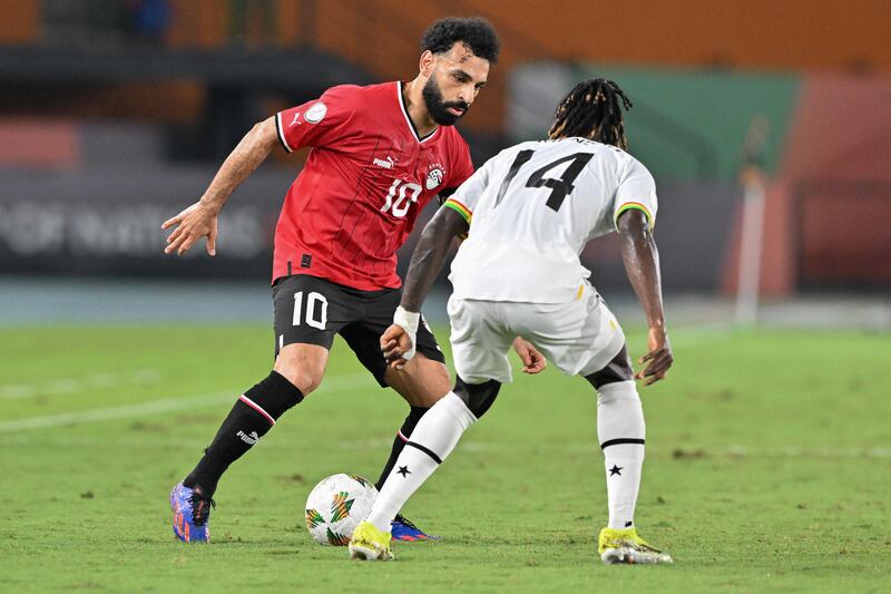 Egypt's Mohamed Salah up against Ghana's Gideon Mensah. AFP