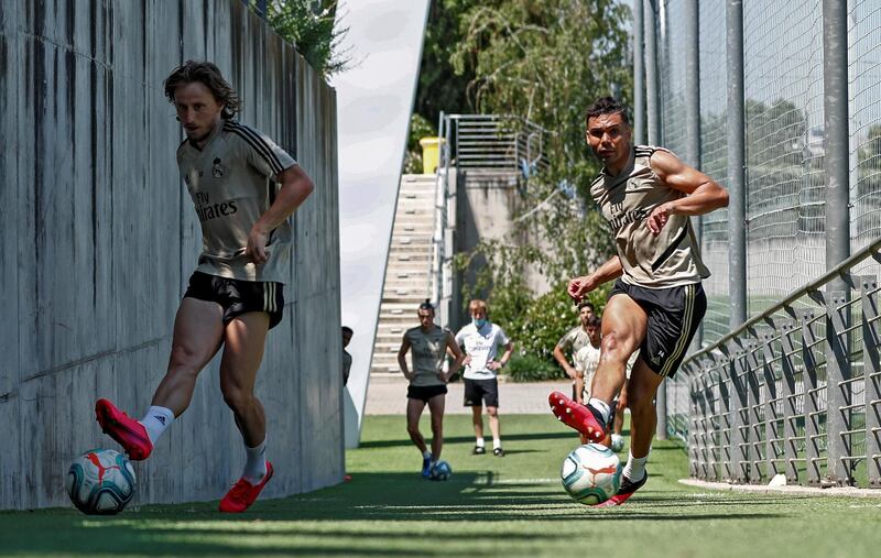 MADRID, SPAIN - MAY 22: (L-R) Luka Modric and Casemiro of Real Madrid kick the ball during the team's training session amid Covid-19 pandemic at Valdebebas training ground on May 22, 2020 in Madrid, Spain. (Photo by Antonio Villalba/Real Madrid via Getty Images)