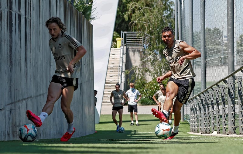 MADRID, SPAIN - MAY 22: (L-R) Luka Modric and Casemiro of Real Madrid kick the ball during the team's training session amid Covid-19 pandemic at Valdebebas training ground on May 22, 2020 in Madrid, Spain. (Photo by Antonio Villalba/Real Madrid via Getty Images)