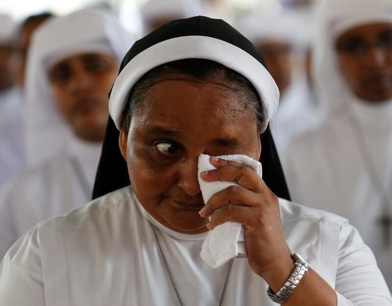 A nun reacts during a mass in Negombo. Reuters