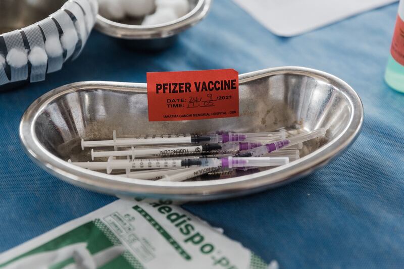 Doses containing Pfizer vaccines to be administered is seen ahead of the launch of the VaxuMzansi National Vaccine Day Campaign at the Gandhi Phoenix Settlement in Bhambayi township, north of Durban. AFP