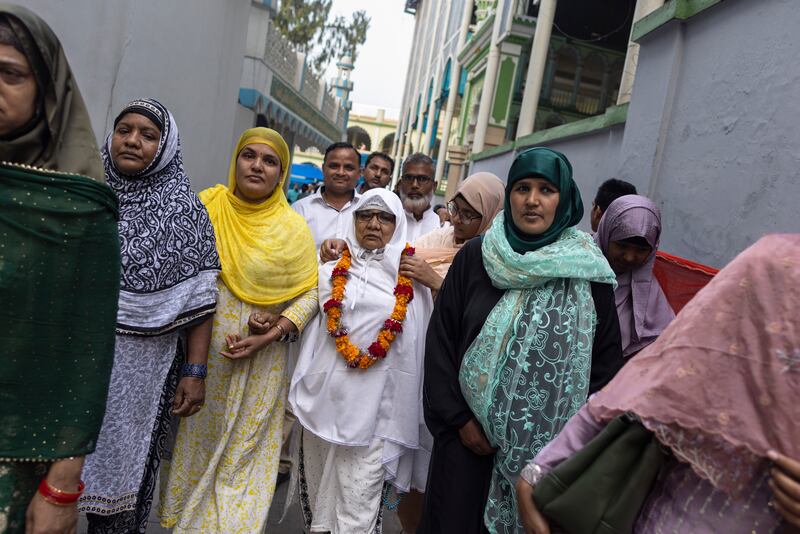 At Kashmiri Mashjid in Kathmandu, Nepal, relatives gather to wish their grandmother well as she leaves for Hajj in Saudi Arabia. EPA