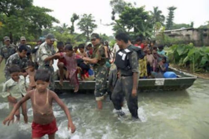Indian army soldiers help transport children to safer areas in Madhepura district, in the northern Indian state of Bihar.