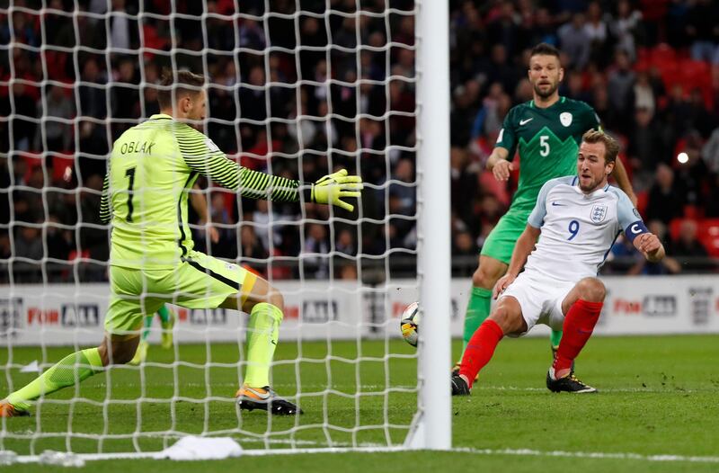 Harry Kane, right, scores the only goal of the game for England against Slovenia at Wembley Stadium. Kirsty Wigglesworth / AP Photo