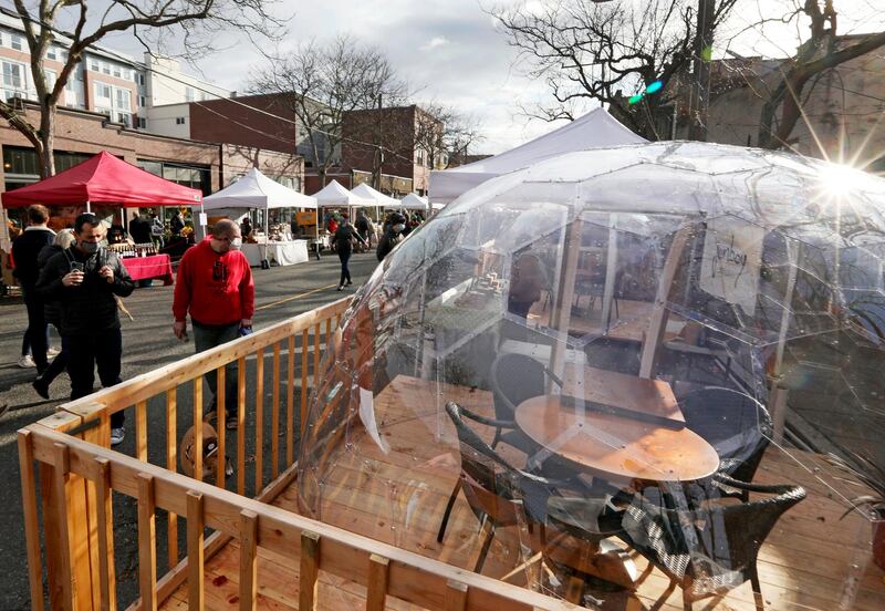 The Ballard Farmers Market, seen shortly after Washington Governor Jay Inslee's executive orders to combat Covid-19 in Seattle's Ballard neighbourhood. At right is San Fermo, an Italian restaurant's outdoor seating geodome.  AP
