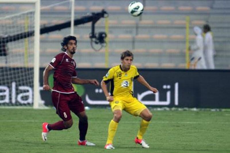 Hamdan Al Kamali, left, scored once for Al Ain which was not enough to offset the three goals scored for Al Ahli by Emiliano Alfaro, right.