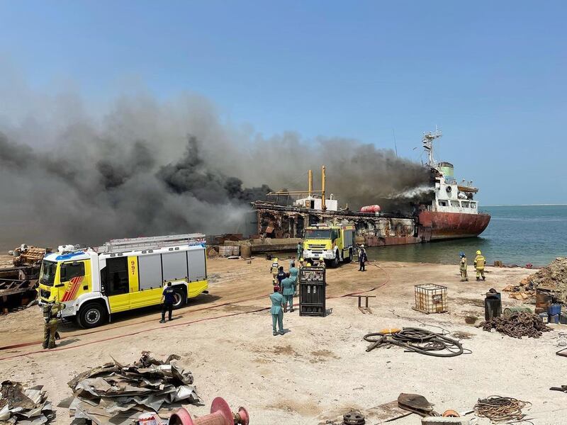 Crews tackle a fire on a vessel in the Rafa port area of Umm Al Quwain. Photo: UAQ Civil Defence