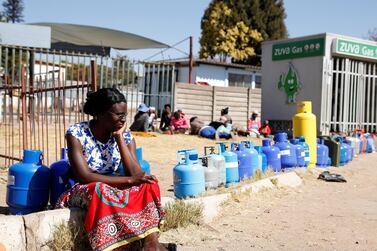 A woman waits to buy gas at a service station in Harare, Zimbabwe, July 16, 2019. Reuters