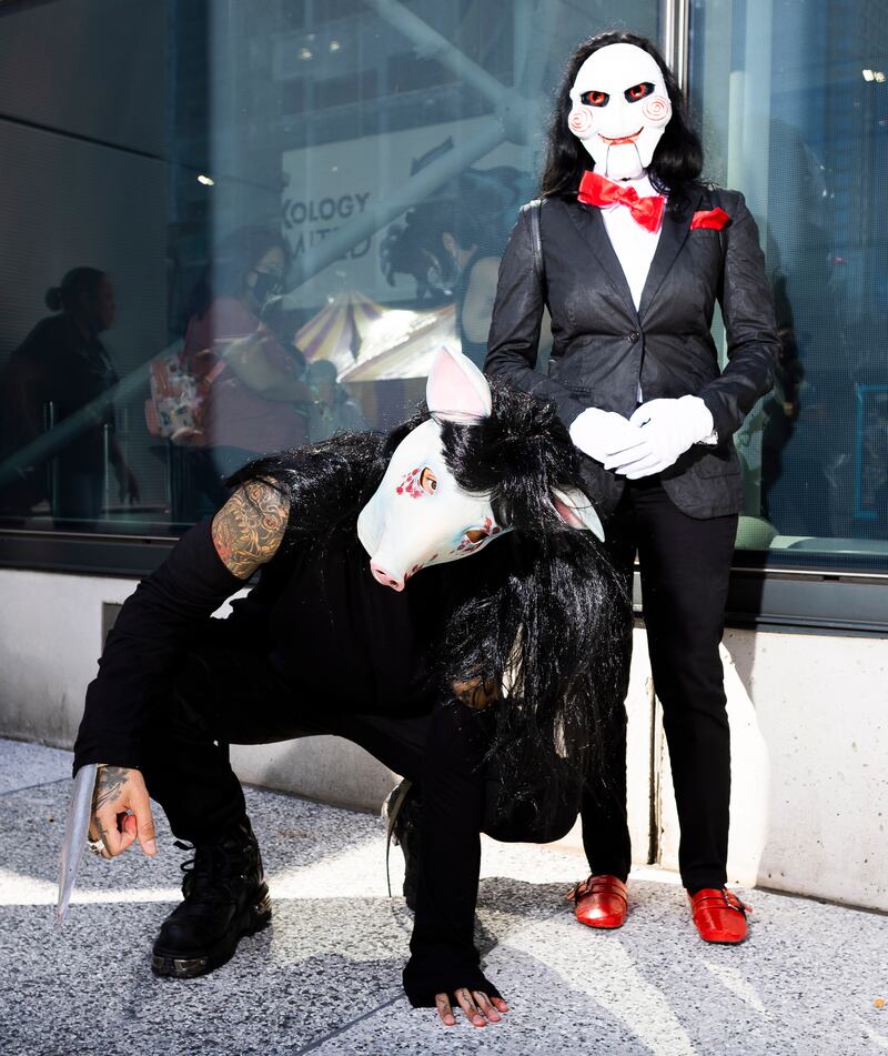 George Solages, left, and Judi Haniff of New York pose in costumes from the movie 'Saw' at New York Comic Con. Justin Lane / EPA