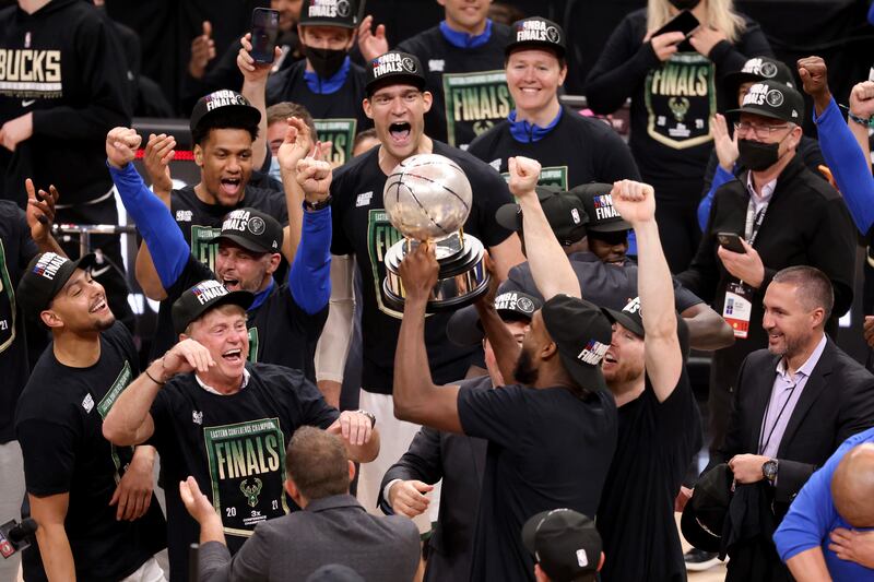 Milwaukee Bucks celebrate with the Eastern Conference trophy after defeating the Atlanta Hawks in Game 6. Reuters