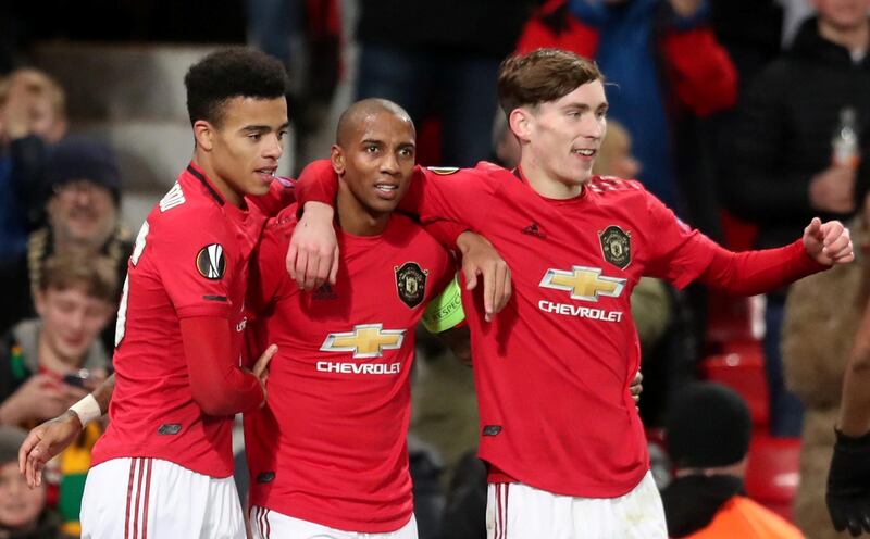 Manchester United's Ashley Young celebrates scoring the first goal with teammates on Thursday. Reuters