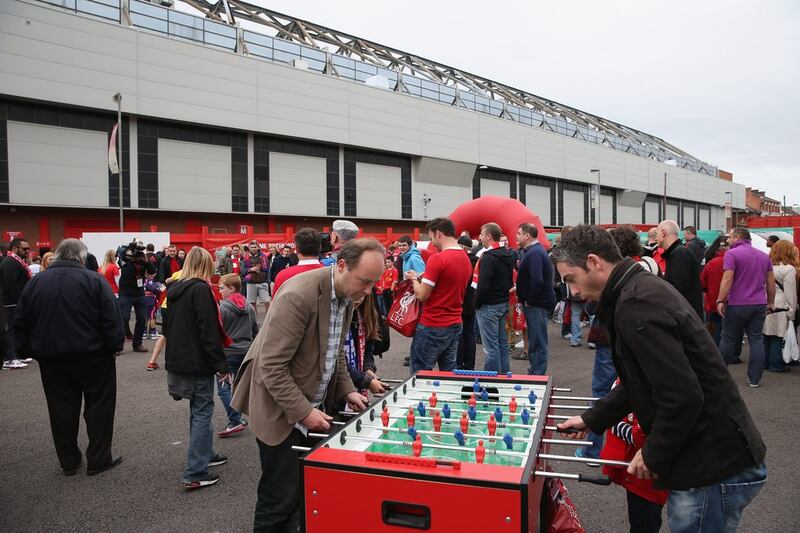 Liverpool supporters play foosball outside Anfield. Getty Images