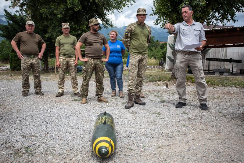 Ukrainian soldiers and members of civilian demining organisations take part in a training exercise for bomb disposal experts in Peja, Kosovo. Getty