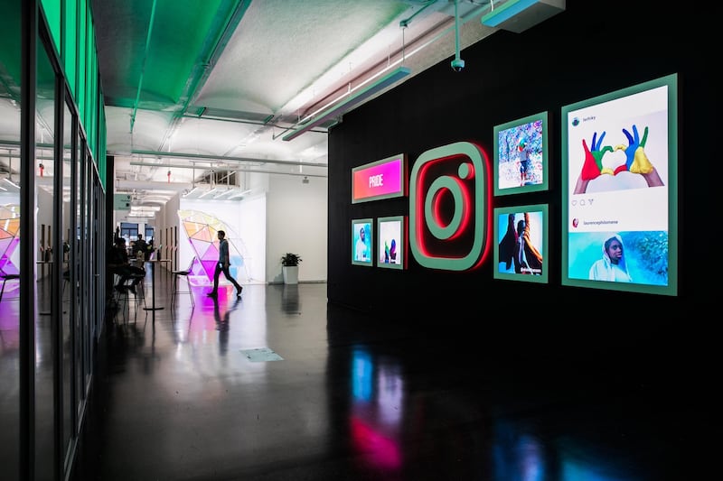 Signage and photographs are displayed at the Instagram Inc. office in New York, U.S., on Monday, June 4, 2018. Once, Instagram was a simple photo-sharing app, a way for iPhone shutterbugs to show off their latest cool pics. Now, its visual nature and 1 billion active users have sellers salivating over its potential as a place to sell everything from dresses to furniture. Photographer: Jeenah Moon/Bloomberg