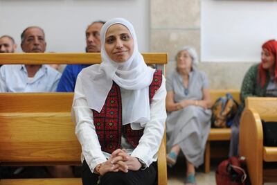 In this Tuesday, July 31, 2018 photo, Arab poet Dareen Tatour sits in a courtroom in Nazareth, Israel. The Israeli court sentenced Tatour to five months in prison for incitement to violence in social media posts she made during a wave of Israeli-Palestinian violence. Tatour's case drew international attention after Israel put her under extended house arrest for her poems. More than 150 literary figures, including authors Alice Walker and Naomi Klein, called for Tatour's release. (AP Photo/Rami Shllush)