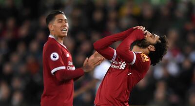 SWANSEA, WALES - JANUARY 22:  Liverpool player Mohamed Salah reacts after missing a chance as Roberto Firmino (l) looks on during the Premier League match between Swansea City and Liverpool at Liberty Stadium on January 22, 2018 in Swansea, Wales.  (Photo by Stu Forster/Getty Images)