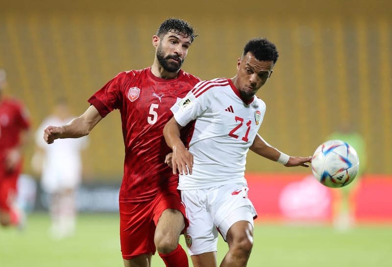 UAE's Fahad Badr battles with Bahrain's Hamad Al Shamsan during the 2026 World Cup qualifying match at Zabeel Stadium, Dubai on June 11, 2024. Chris Whiteoak / The National