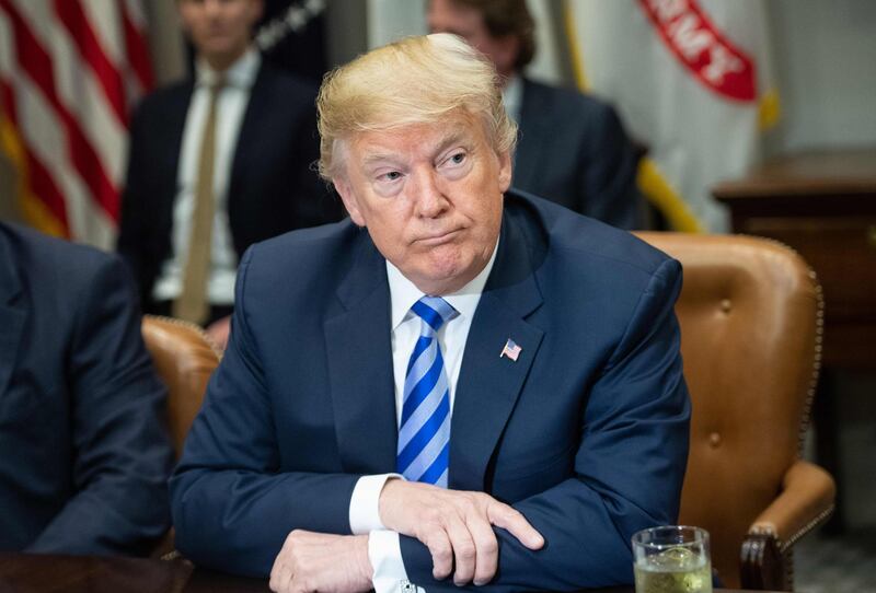 (FILES) In this file photo taken on May 11, 2018 US President Donald Trump speaks during a meeting with carmakers in the Roosevelt Room at the White House in Washington, DC. Donald Trump on May 17, 2018 marked the one-year anniversary of special counsel Robert Mueller's probe into ties between the president's campaign team and Russia with a trademark tweet, reiterating "there is still No Collusion." "Congratulations America, we are now into the second year of the greatest Witch Hunt in American History...and there is still No Collusion and No Obstruction," Trump tweeted. The Republican president has repeatedly insisted he's the target of a "witch hunt" and denied any collusion between Team Trump and Moscow to win the presidency against former Democratic rival Hillary Clinton.
 / AFP / NICHOLAS KAMM
