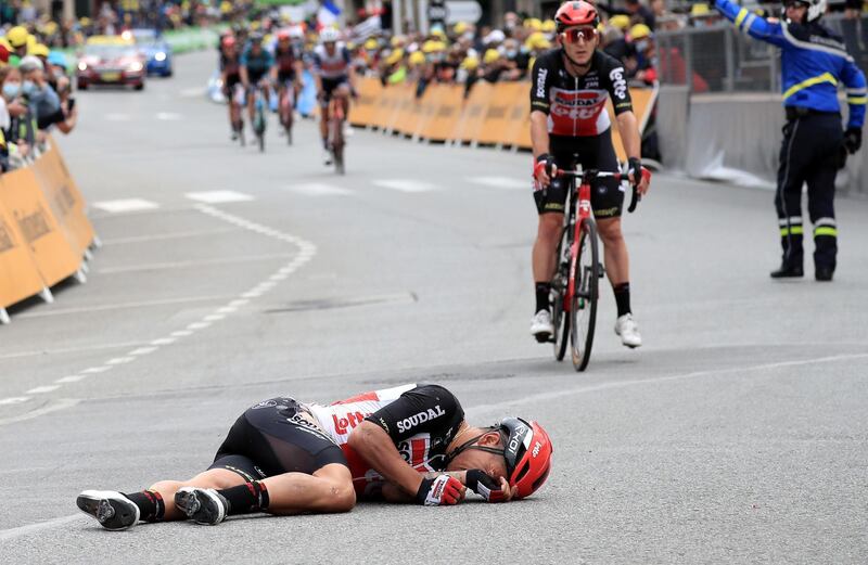 Australian rider Caleb Ewan of the Lotto Soudal team lies on the street after he crashed on Monday. EPA