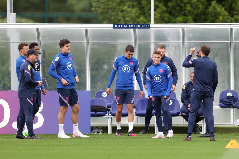 England manager Gareth Southgate, right, talks to his players at training. Getty