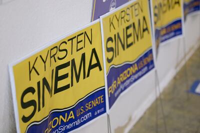 Campaign signs for Krysten Sinema, Democratic U.S. Senate candidate from Arizona, lean against a wall during a campaign event in Phoenix, Arizona, U.S., on Thursday, Nov. 1, 2018. In Arizona, which backed Trump in 2016, Republican Martha McSally is going against Sinema for the Senate seat being vacated by Republican Jeff Flake. Photographer: Caitlin O'Hara/Bloomberg