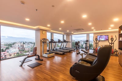 Guests running on the gym's treadmills have views overlooking the surrounding city and mountains. Courtesy Vivanta Kathmandu