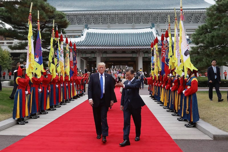 South Korean president Moon Jae-in and US president Donald Trump walk towards a guard of honour during a welcoming ceremony at the presidential Blue House in Seoul, South Korea. Chung Sung-Jun / EPA