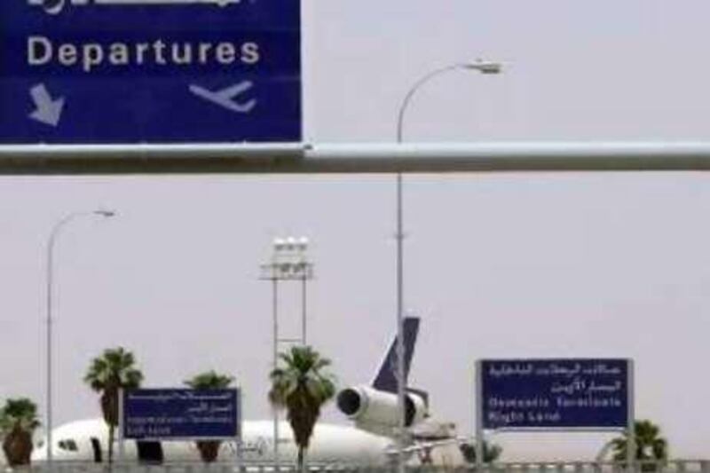 An Al Saudia airplane is seen parked at the departures terminal at Prince Khalid international airport in Riyadh Wednesday May 14, 2003. Non-essential US diplomats were ordered out and  other westerners made plans to leave Wednesday following Monday's suicide attacks. (AP Photo/Hasan Jamali)