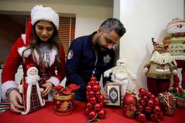 Ziad, a Muslim man, and his wife Lamees Homidan, a Lebanese Christian, make Christmas decorations at their home, in Riyadh, Saudi Arabia. Reuters