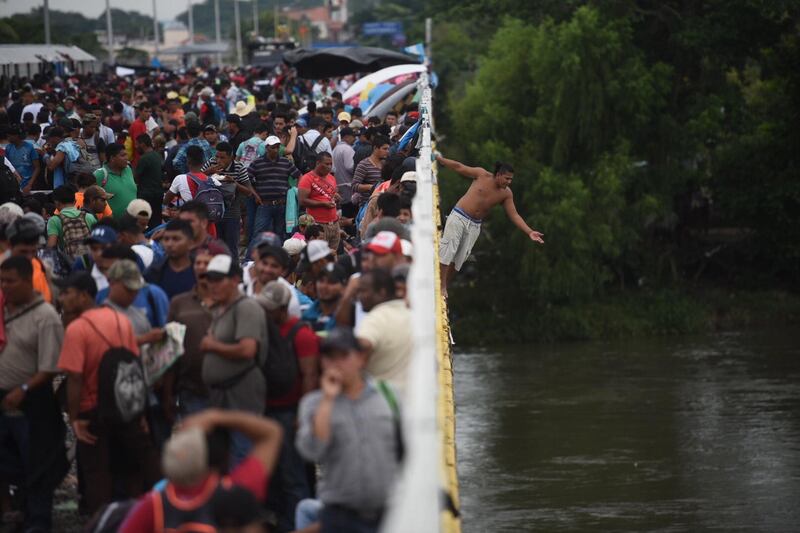 Some jump in the Suchiate River in a bid to make the crossing.  EPA