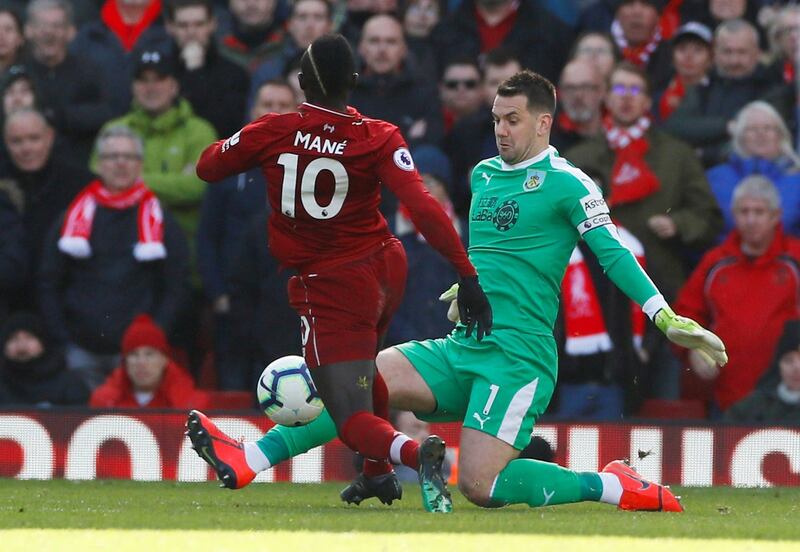 Liverpool's Sadio Mane goes past Burnley's Tom Heaton before scoring their fourth goal. Reuters