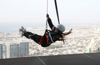 Swing out over the city at Sky Edge Walk at the Address Sky Views Hotel in Downtown Dubai. Pawan Singh / The National