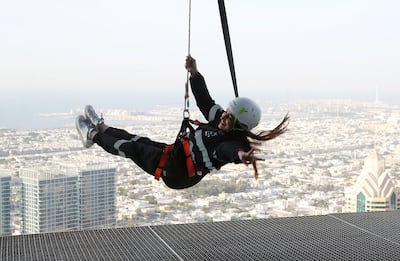 Swing out over the city at Sky Edge Walk at the Address Sky Views Hotel in Downtown Dubai. Pawan Singh / The National