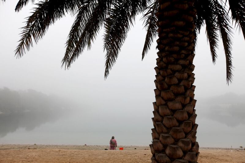 January 9, 2011 / Abu Dhabi / (Rich-Joseph Facun / The National) Despite heavy fog throughout Abu Dhabu today, a woman spends the morning along the shore, Sunday, January 9, 2011 in Abu Dhabi. 