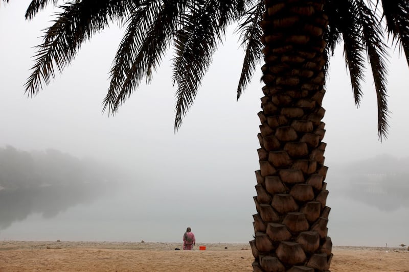 January 9, 2011 / Abu Dhabi / (Rich-Joseph Facun / The National) Despite heavy fog throughout Abu Dhabu today, a woman spends the morning along the shore, Sunday, January 9, 2011 in Abu Dhabi. 