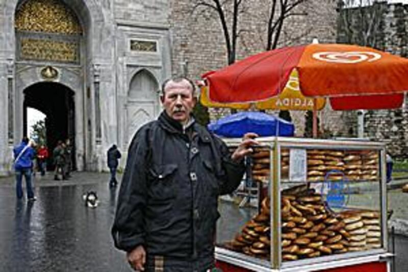 Riza Ece, 54, sells freshly baked simits that have been cooked in a traditional wooden oven.