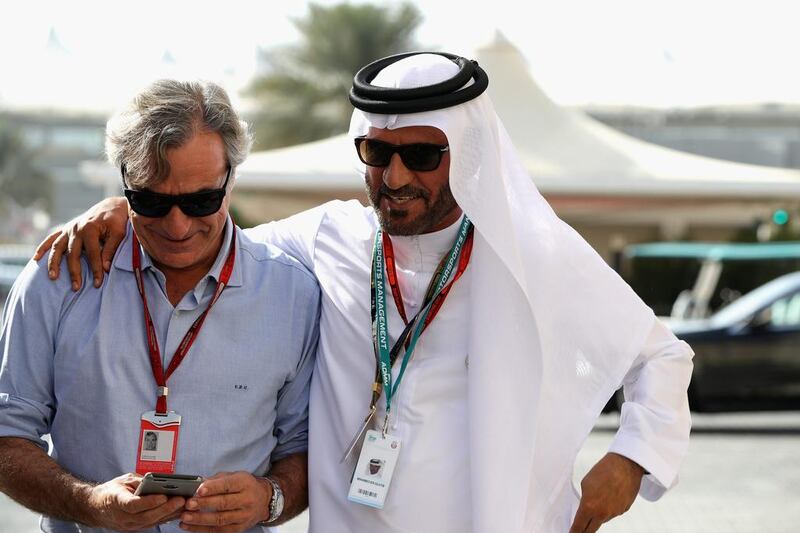 Carlos Sainz walks with UAE motoring president Mohammed Ben Sulayem in the paddock. Mark Thompson / Getty Images