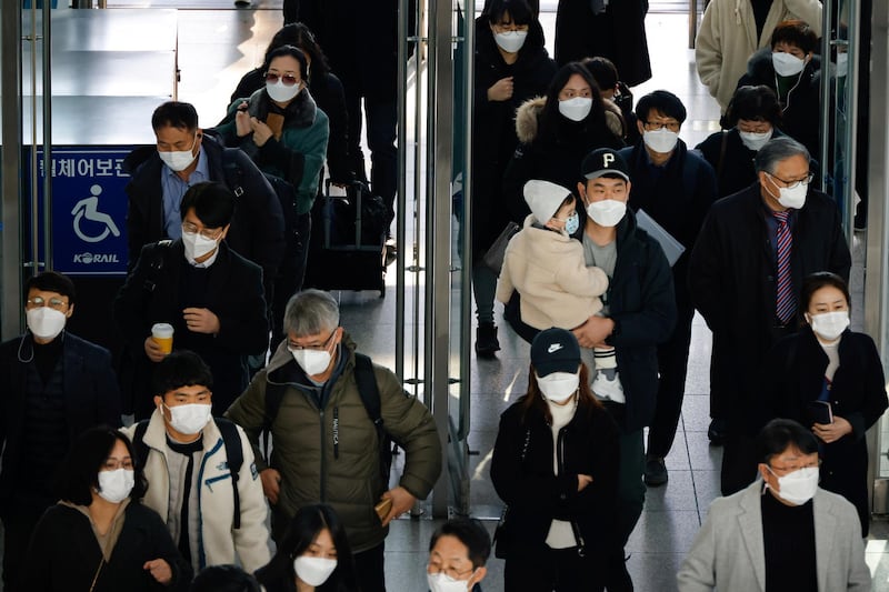 People walk at a railway station in Seoul, South Korea. Reuters