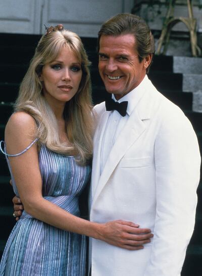 FILE - Actor Roger Moore, right, poses with his co-star Tanya Roberts from the James Bond film "A View to a Kill," outside of ChÃ¢teau de Chantilly in Chantilly, France on Aug. 17, 1984. Roberts, who captivated James Bond in â€œA View to a Killâ€ and appeared in the sitcom â€œThat â€™70s Show,â€ died Monday,  Jan. 4, 2021, several hours after she was mistakenly declared dead by her publicist and her partner. Roberts' partner Lance O'Brien confirmed her death Tuesday after picking up her personal effects at a Los Angeles hospital. She was 65. (AP Photo/Alexis Duclos, File)