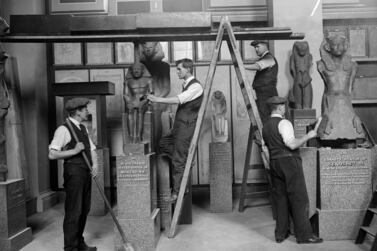 Decorators prepare an exhibition of antiquities in 1928 at the Egyptian Galleries in the British Museum, London. Getty images