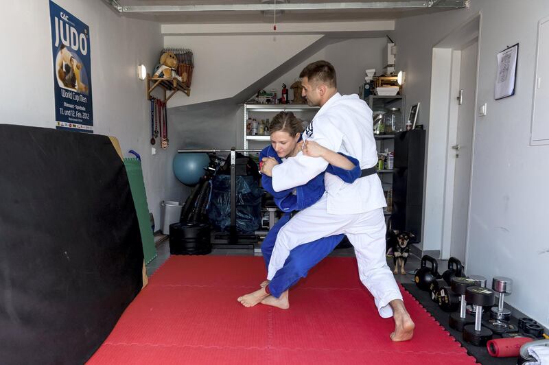 epa08348035 Polish judoka Agata Ozdoba-Blach (L) with her husband and trainer Lukasz Blach train in the garage at their home during the coronavirus pandemic in Dobrzykowice, western Poland, 07 April 2020. Due to the lock-down due to the coronavirus pandemic many athletes do their training routines and exercises at their improvised gym at home. Countries around the world are taking increased measures to stem the widespread of the SARS-CoV-2 coronavirus which causes the COVID-19 disease.  EPA-EFE/Maciej Kulczynski POLAND OUT *** Local Caption *** 56009014