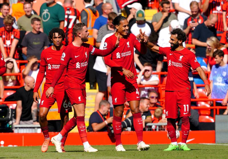 Liverpool's Virgil van Dijk, centre, celebrates scoring his side's fifth goal against Bournemouth at Anfield on Saturday, August 27, 2022.  AP