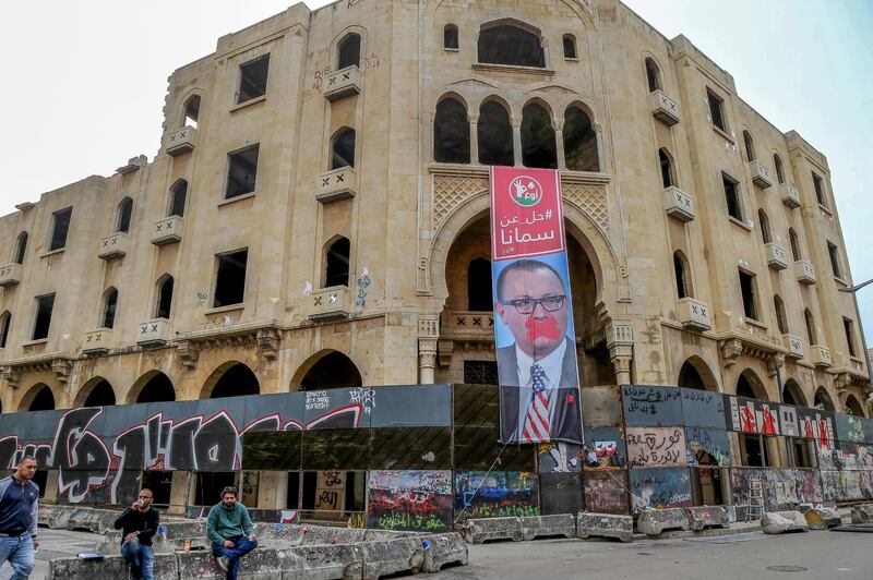 A banner depicting Jeffrey Feltman, former US ambassador to Lebanon reading 'Leave us' hangs from the Grand Theatre building in Beirut.  EPA