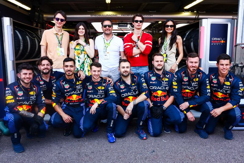 Frederic Arnault, Alexandra Daddario, Julien Tornare, Nicholas Galitzine and Kelsey Merritt pose for a photo with the Red Bull Racing team. Getty Images