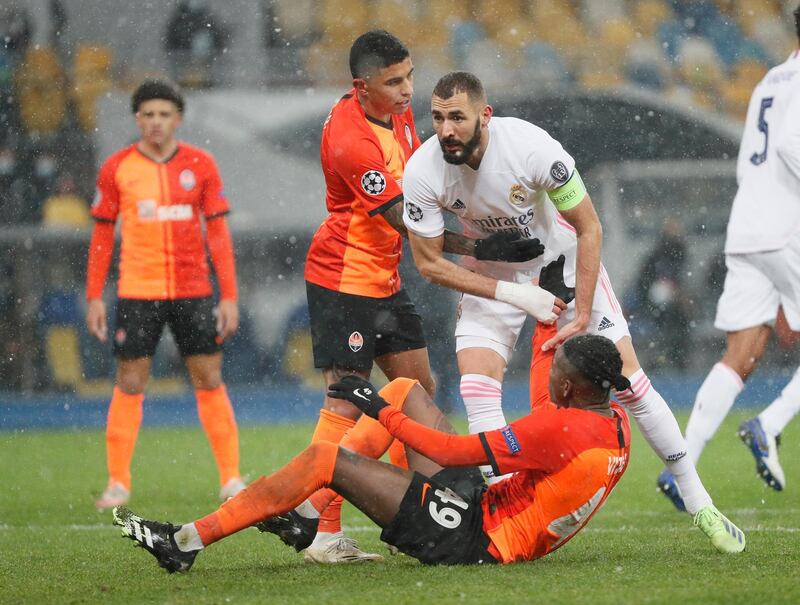 Shakhtar Donetsk's Vitao in action with Real Madrid's Karim Benzema. Reuters