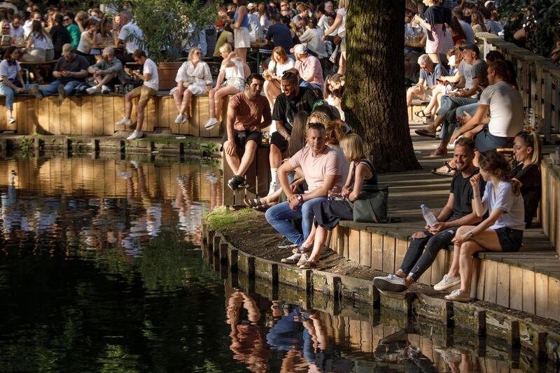 Numerous people enjoy the sun in Berlin, Germany. Getty Images