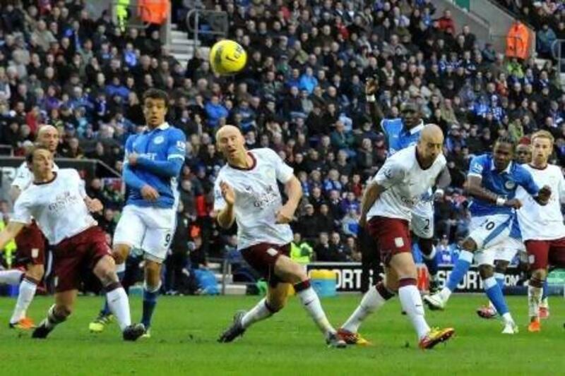 Wigan Athletic’s Hugo Rodallega, second right, fires in a shot at the death that sailed narrowly over the Aston Villa crossbar in yesterday’s 0-0 draw at the DW Stadium.