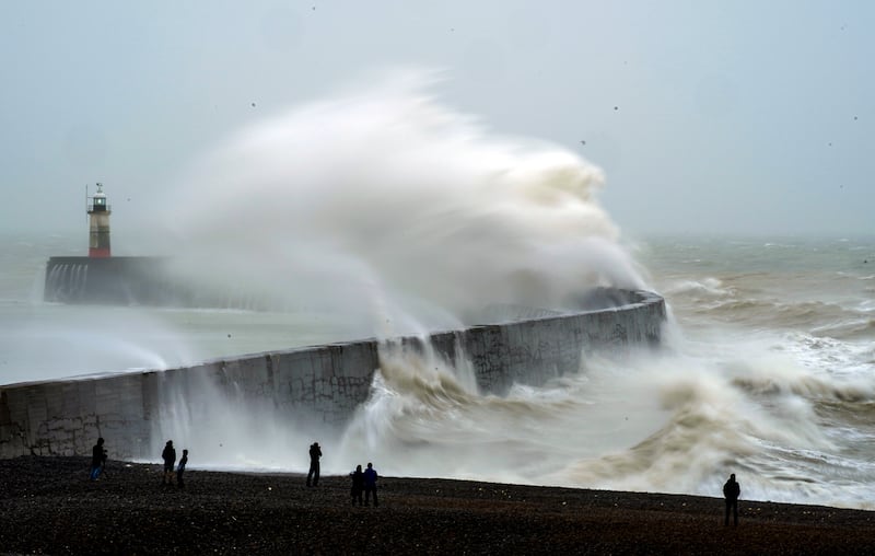 A wave crashes over Newhaven lighthouse at West Quay in East Sussex, England, on February 20. PA