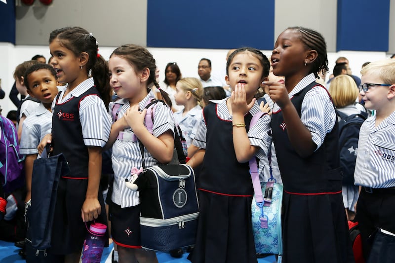 DUBAI , UNITED ARAB EMIRATES – Aug 30 , 2015 : Students waiting to go in their classes on the first day of school at the Dubai British School in Jumeirah Park in Dubai. ( Pawan Singh / The National ) For News. Story by Nadeem Hanif  *** Local Caption ***  PS3008- BRITISH SCHOOL01.jpg